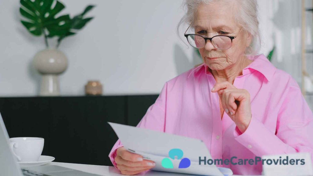 Senior woman reading and going over paperwork at a table