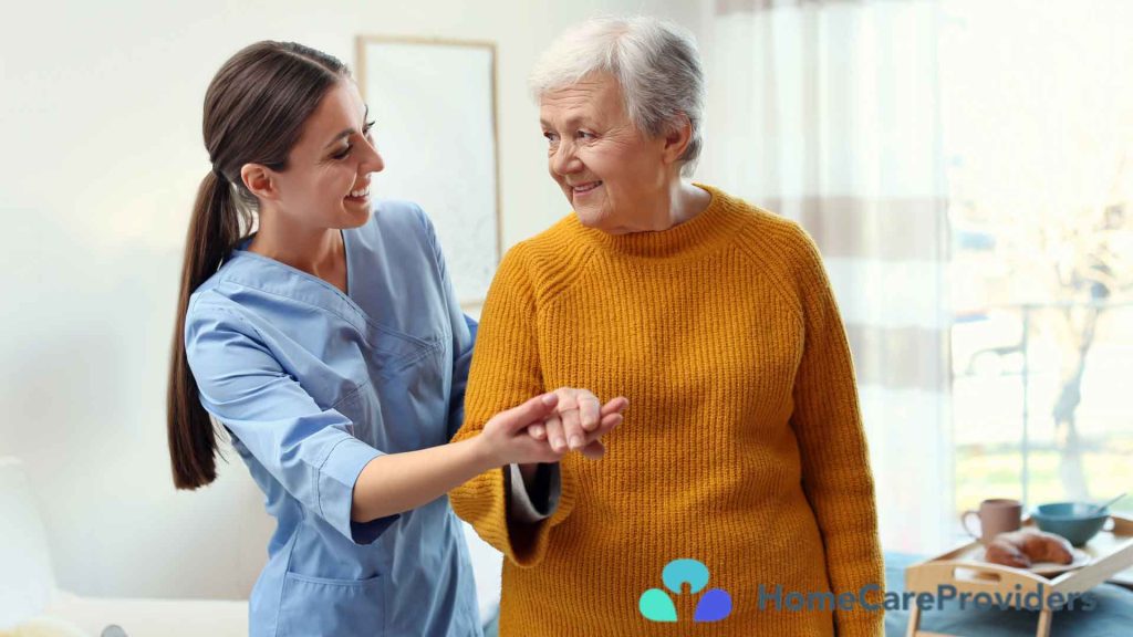 An elderly woman being assisted at home by a companion caregiver